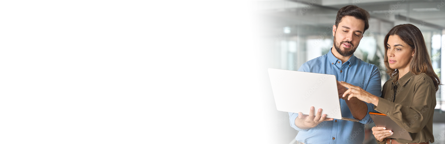 Young man and woman working together on a laptop