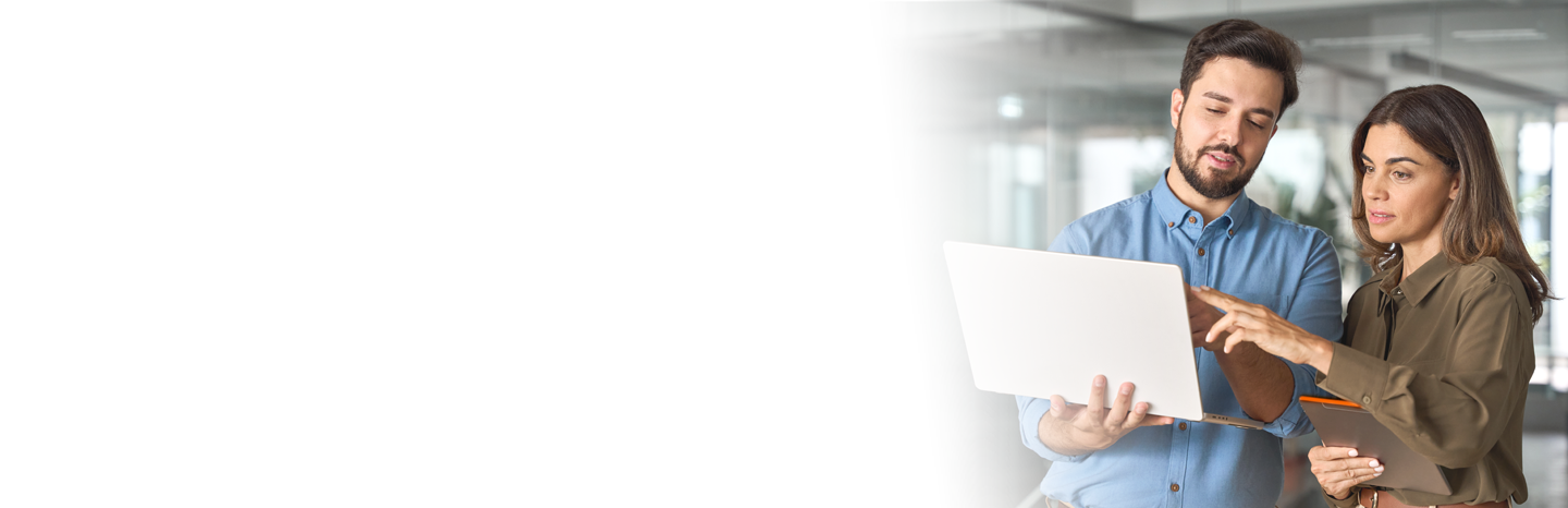 Young man and woman working together on a laptop